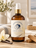 PattyAroma Sandalwood Vanilla Linen Spray in an amber bottle